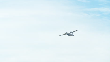 Ascending-airplane-after-a-successful-takeoff-during-the-day,-thin-with-white-clouds-and-blue-sky,-Turbo-Prop-airplane,-Thailand