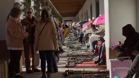 Tourists-shopping-from-street-vendors-in-downtown-Santa-Fe,-New-Mexico-with-stable-video-shot