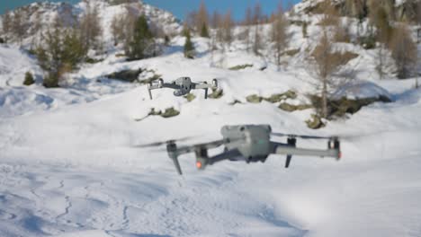 DJI-Air-2S-And-Air-3-Hovering-Above-Snowy-Landscape