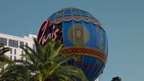 POV-Driving-Past-Neon-sign-for-the-famous-Paris-Hotel-and-Casino