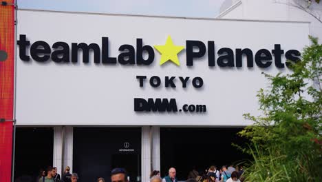 Slow-pan-across-exterior-building-of-Teamlab-Planets-in-Toyosu-district-of-Tokyo