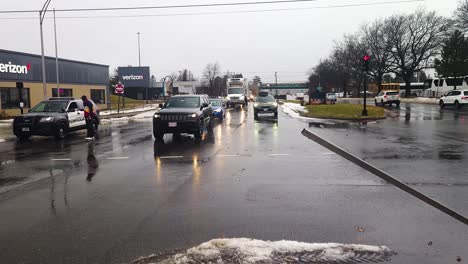 Cars-making-their-way-through-flooded-area-of-Portland,-Maine