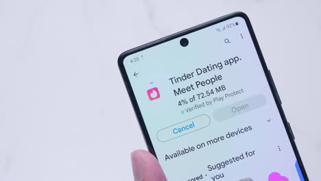 Downloading-and-installing-a-new-social-networking-application-specific-for-dating-and-meeting-new-people