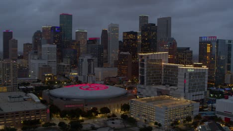 Establishing-aerial-view-of-downtown-Houston,-Texas-at-night