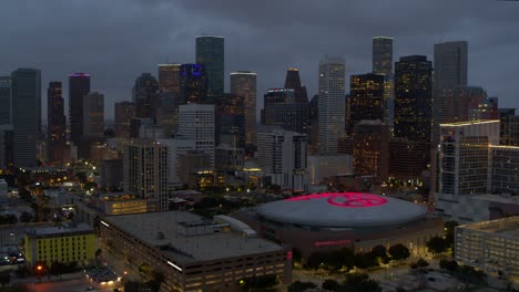 Establishing-aerial-view-of-downtown-Houston,-Texas-at-night