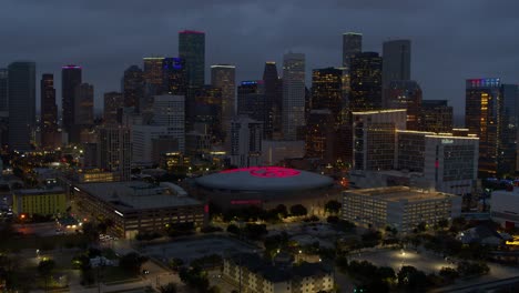 Establishing-aerial-view-of-downtown-Houston,-Texas-at-night