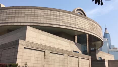 Building-of-Shanghai-Museum-of-Art-in-China,-modern-architecture,-panning-shot