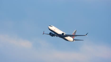 Turkish-Airlines-airplane-in-mid-flight-against-a-partly-cloudy-sky