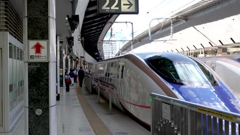 High-speed-travel,-Japanese-bullet-train-arrives-at-Shinkansen-rail-station
