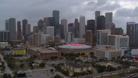 Establishing-aerial-view-of-downtown-Houston,-Texas-at-night