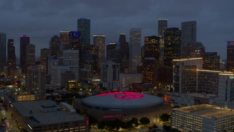 Establishing-aerial-view-of-downtown-Houston,-Texas-at-night