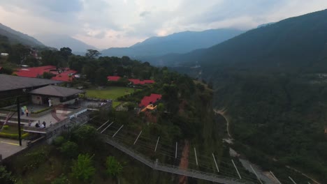 Person-swinging-overlooking-Kushma-Suspension-Bridge