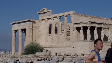 Tourists-watching-the-Parthenon-temple,-ancient-temple-center-of-Greece,-Athens