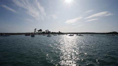 Sailing-Past-Small-Sailing-Boats-At-Port-La-Foret-On-Sunny-Day