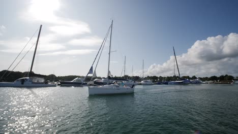 Sail-Boat-Passing-By-In-Marina-At-Port-La-Foret-On-Sunny-Day