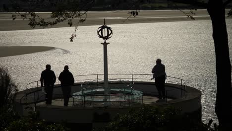 People-At-River-Dwyryd-At-Low-Tide-In-Portmeirion,-An-Italian-Style-Tourist-Village-On-The-Coast-Of-North-Wales,-High-Contrast-Footage