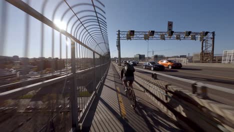 POV-Behind-Bike-Courier-Exiting-Jacques-Cartier-Bridge-In-Montreal