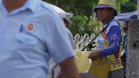 Elderly-Peruvian-Male-Waiting-To-Cross-Road-In-Lima