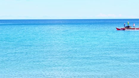 Local-Fishermen-Sailing-On-The-Beautiful-Blue-Ocean-During-The-Coronavirus-Lockdown-In-Surigao,-Philippines