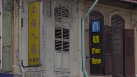 Close-Window-Shutters-Above-Shops-On-Geylang-Road-In-Singapore