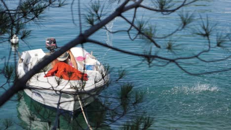 Man-throw-water-out-of-boat,-slow-motion