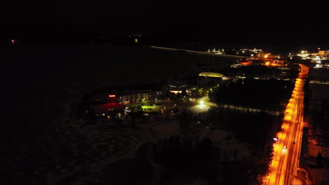 Aerial-view-around-the-Tropiclandia-waterpark-and-hotel,-night-in-Vaasa,-Finland