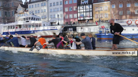 Rowing-team-in-Gdansk-canal,-slow-motion