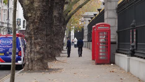 London-street-with-police-patrol,-slow-motion