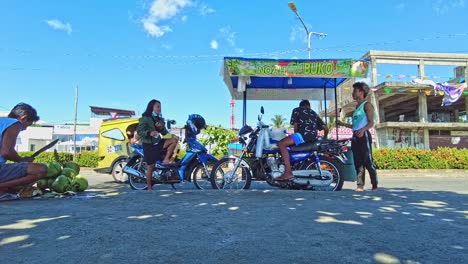 Buko-or-Coconut-Juice-Seller-on-the-boulevard-in-Surigao-City-Philippines,-Timelapse