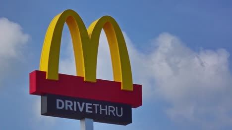 Static-locked-off-shot-of-a-McDonalds-Fast-Food-Restaurant-Drive-Thru-sign-in-Surigao-City-Philippines