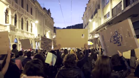 Women-are-marching-and-protesting-in-the-Historic-Center-of-Quito,-Ecuador-during-the-International-Women's-day