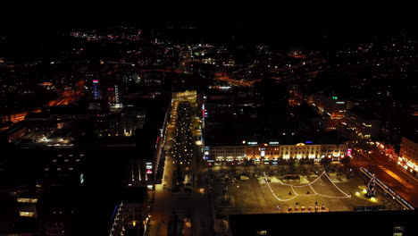 Aerial-view-backwards-over-the-Hovioikeudenpuistikko-street,-night-in-Vaasa,-Finland