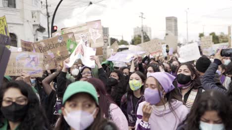 Women-are-chanting-and-singing-in-favor-of-women's-rights-and-the-stop-of-violence-during-the-International-Women's-Day-in-Quito,-Ecuador