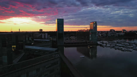 Aerial-view-of-Keilaniemi-business-center,-sunset-in-Finland---reverse,-drone-shot