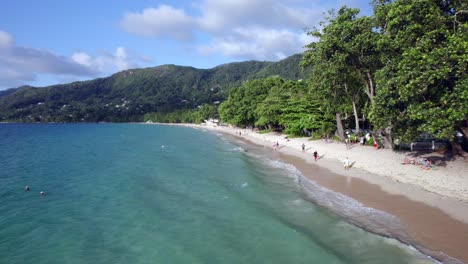 Low-Aerial-Shot-of-Beau-Vallon-Beach,-Mahe,-Seychelles