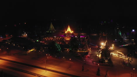 Fantastic-Christmasy-Aerial-Shot-of-Brightly-Illuminated-Colours-of-Santa-Claus-Home-Town