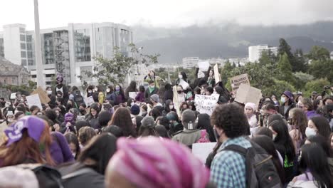 Women-are-gathering-around-in-a-park-during-the-march-of-the-International-Women's-Day-in-Quito,-Ecuador