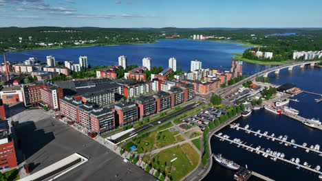 Aerial-tracking-shot-of-condos-in-Lutakko,-sunny,-summer-day-in-Jyvaskyla,-Finland