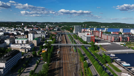 Aerial-overview-of-the-train-station-of-Jyvaskyla,-sunny,-summer-day-in-Central-Finland