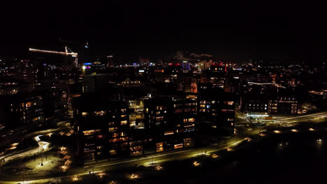 Aerial-view-around-modern-condos-on-the-coast-of-Tampere,-winter-night-in-Finland