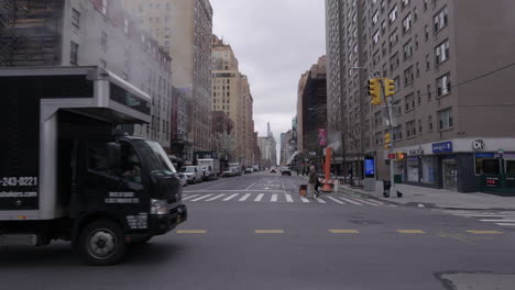 Old-couple-with-face-masks-crossing-14th-street-with-smoke-in-slow-motion