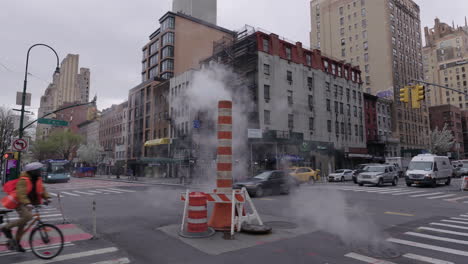 Smoky-Steam-pipe-with-Ambulance-passing-by-during-Coronavirus-outbreak-slow-motion