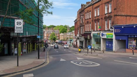 Cars-Driving-Through-Blackheath-Village,-South-East-London