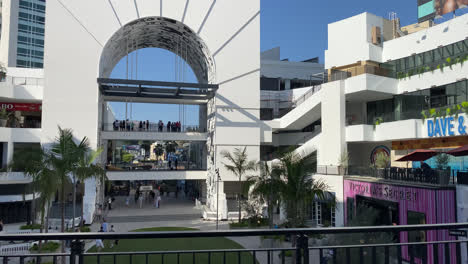 Crowd-Of-People-Shopping-At-Business-At-the-Hollywood-Boulevard-TCL-Theatre-Shopping-Center-In-Hollywood,-California-At-Daytime