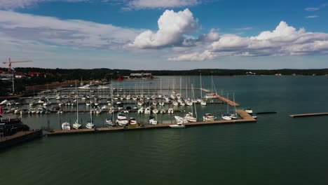 Aerial-view-around-the-marina-in-Maarianhamina-city,-summer-in-Ahvenanmaa,-Finland---circling,-drone-shot