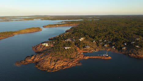 Aerial-view-around-the-Havsvidden-resort,-golden-hour-in-Aland,-Finland---orbit,-drone-shot