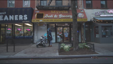 Shops-and-stores-on-a-merchant-street-in-Brooklyn-Driving-by