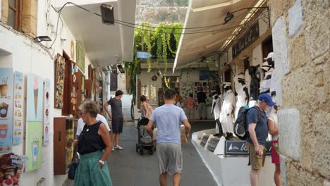 People-in-a-narrow-street-of-Lindos,-Part-two