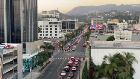 Traffic-On-The-Intersection-In-Downtown-Los-Angeles-At-Dusk-In-California,-USA