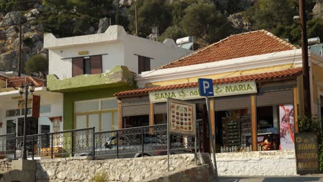 Low-angle-view-of-houses-and-shops-in-the-quiet-village,-Siana